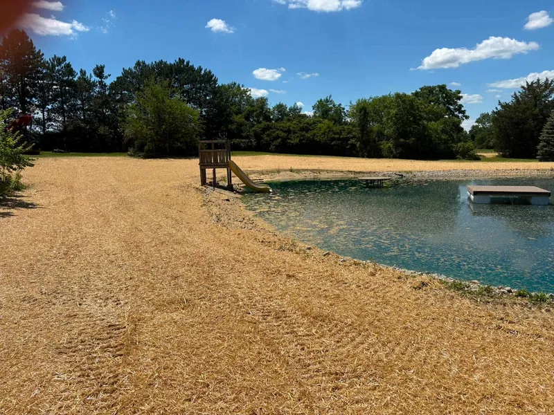 Graded ground around a pond and dock