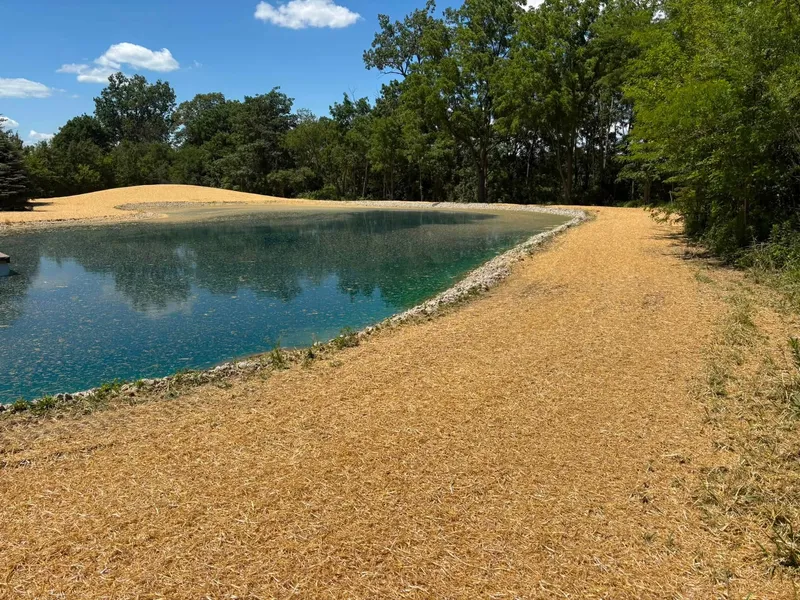 Finish-graded pond bank ready for seed